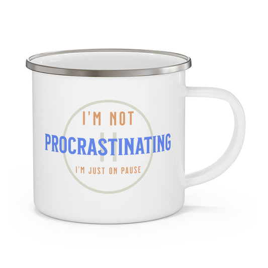 Printifys Funny Procrastination Enamel Camping Mug is perfect for outdoor lovers. It features a white body with a silver rim and displays the humorous phrase, Im not procrastinating, Im just on pause, in blue, beige, and brown lettering. Its a fun design for those who appreciate playful breaks in nature.