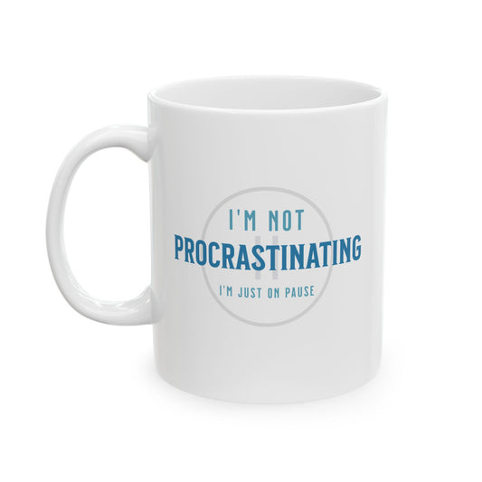 The Printify Procrastination Ceramic Coffee Mug, available in 11oz and 15oz sizes, features the phrase Im not procrastinating, Im just on pause printed in blue and gray, making it a perfect gift for coffee-loving students and professionals.