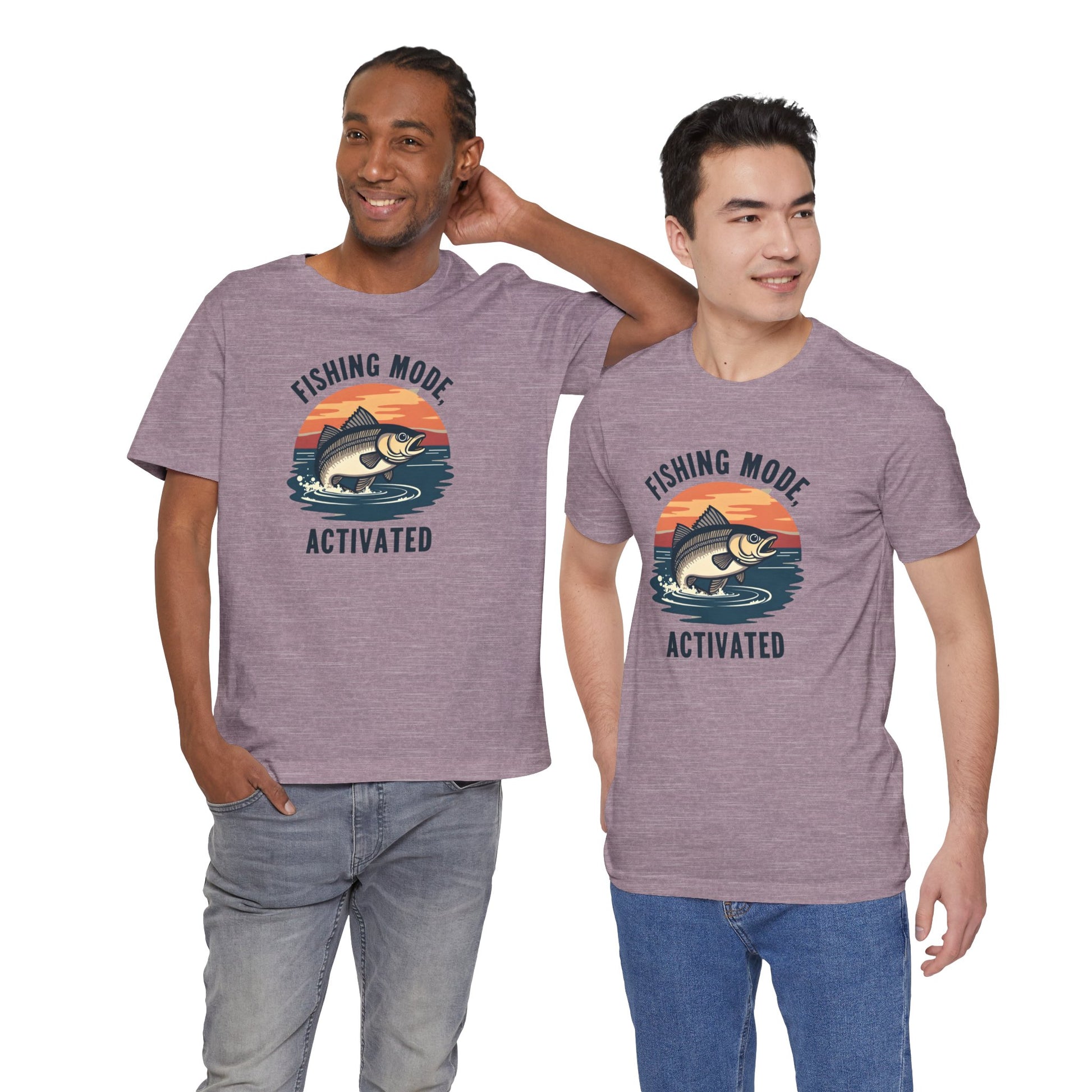 Two smiling men in matching Printifys Fishing Mode Activated tees, crafted from soft Airlume cotton, perfectly capture their casual style. One has long hair tied back, and the other sports short hair, all set against a plain white backdrop.