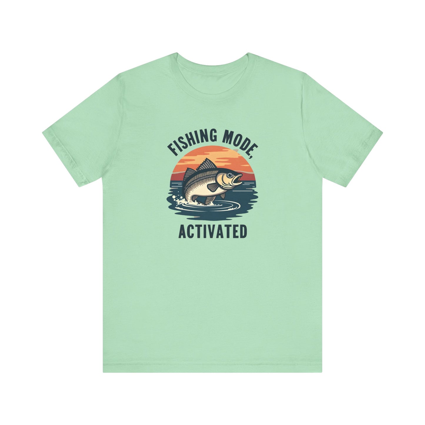 The Printify Fishing Mode Activated Tee for Anglers is a unisex jersey short sleeve shirt in light green, showcasing a fish leaping from water against a sunset. Made from soft Airlume cotton, its ideal for outdoor enthusiasts.