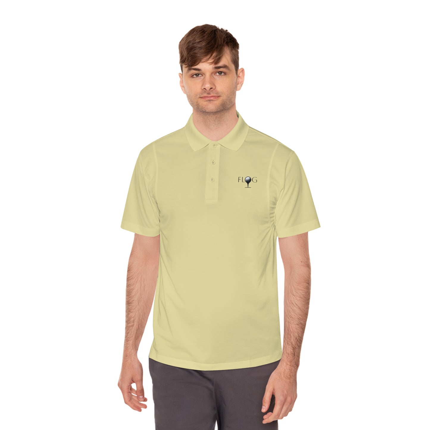 A person in a light yellow Mens Sport Polo Shirt by D&B Apparel, featuring a FLOG logo, stands against a white background. The moisture-wicking fabric ensures comfort as they gaze ahead with short brown hair and dark pants—ideal for golf or casual outings.