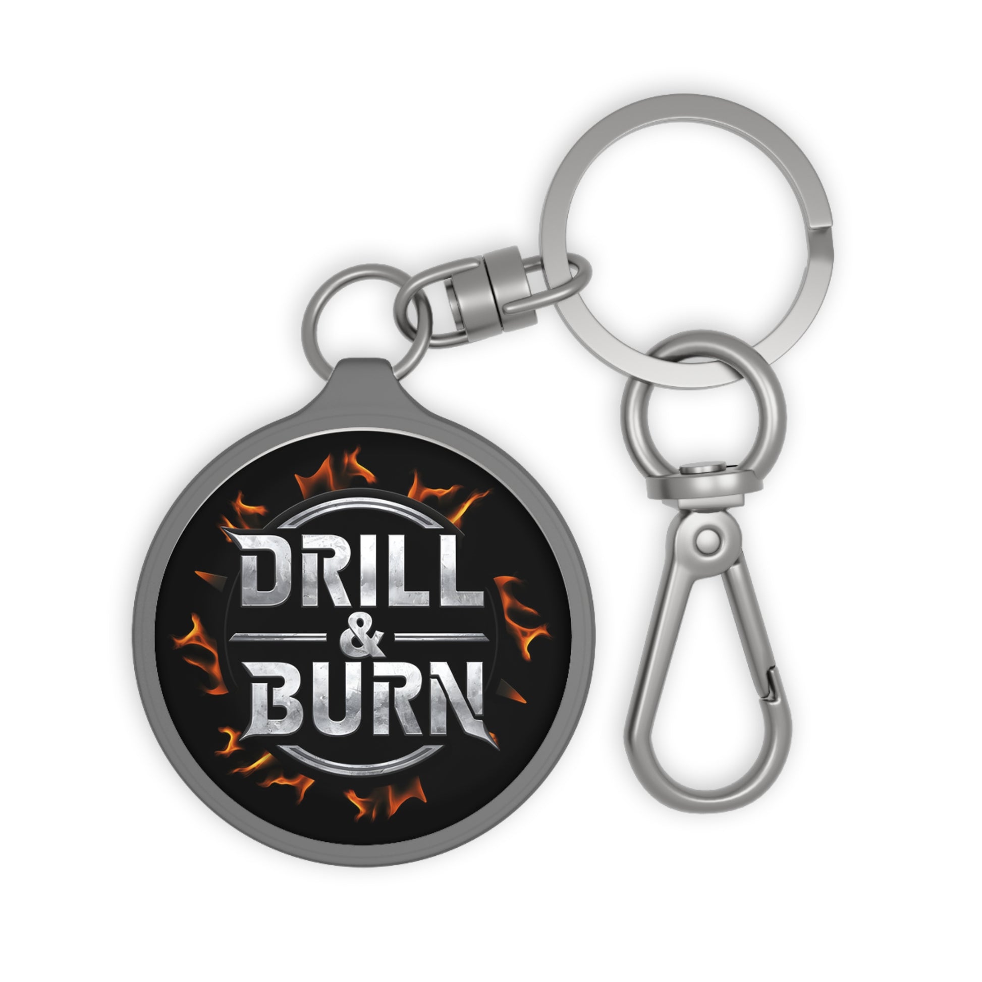 The Drill & Burn Keyring Tag by D&B Apparel features Drill & Burn in metallic letters encircled by flames on a durable acrylic tag, attached to a metal key ring with a clasp. This motivational keychain is perfect for personalized gifts and car enthusiasts.