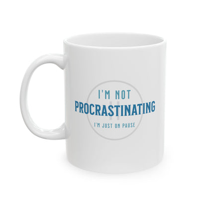 The Printify Procrastination Ceramic Coffee Mug, available in 11oz and 15oz sizes, features the phrase Im not procrastinating, Im just on pause printed in blue and gray, making it a perfect gift for coffee-loving students and professionals.