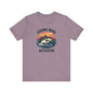 Printifys unisex Fishing Mode Activated gray tee showcases a fish leaping from water against a sunset, crafted from Airlume cotton for comfort on your angling adventures.