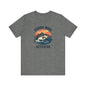This unisex jersey short-sleeve tee from Printify is crafted from premium Airlume cotton and features a gray design of a fish leaping against a sunset, perfectly capturing the Fishing Mode Activated vibe—a must-have for outdoor enthusiasts.