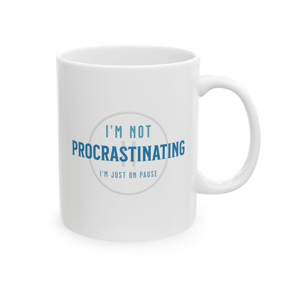 The Printify Procrastination Ceramic Coffee Mug, available in 11oz and 15oz sizes, features blue text reading IM NOT PROCRASTINATING, IM JUST ON PAUSE. Its an ideal gift for coffee drinkers who appreciate lifes pauses.